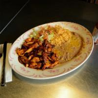Spicy Pollo Chipotle · Spicy chipotle sauce cooked into chicken breast with onions and mushroom.
