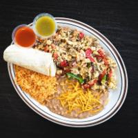 Machaca and Eggs · Beef machaca, green and red bell peppers, onions, 4 eggs. Served with rice, beans, and corn ...