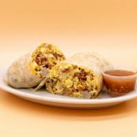 Combo Breakfast Burrito · Ham, bacon, sausage, eggs, fresh hash browns, and melted shredded cheese in a flour tortilla.