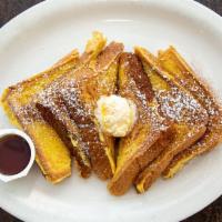Side of French Toast · 6 slices of French toast covered with powdered sugar and cinnamon.