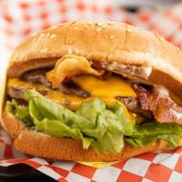 Double Bacon Cheeseburger · Sesame seed bun, double hamburger patty, double American cheese, crispy bacon, lettuce, toma...
