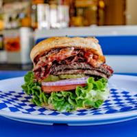 Double Colossal Burger · Sesame seed bun, 2 hamburger patties, juicy pastrami, lettuce, tomato, red onions, pickles, ...