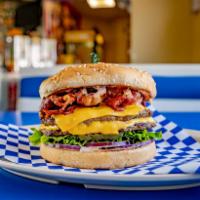 Double Colossal Cheeseburger · Sesame seed bun, 2 hamburger patties, 2 slices of American cheese, juicy pastrami, lettuce, ...
