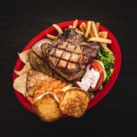 Pork Chop Dinner · Choice of 2 or 3 pork chops. Served with home-made rice, refried beans, French fries, a smal...