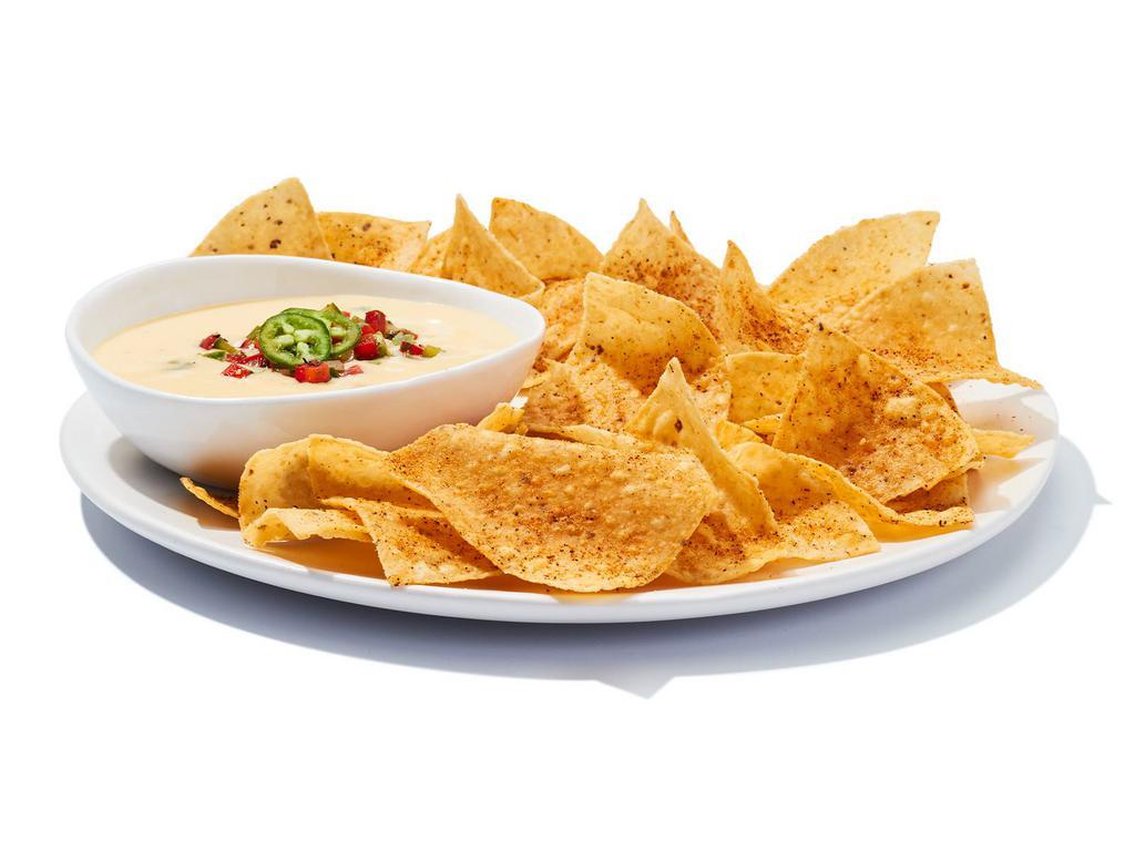 Chips ＆ Queso · It ain’t rocket surgery. It’s a creamy blend of melted cheeses mixed with roasted red and green peppers, topped with housemade pico de gallo. Scoop it up with corn chips and go to town.