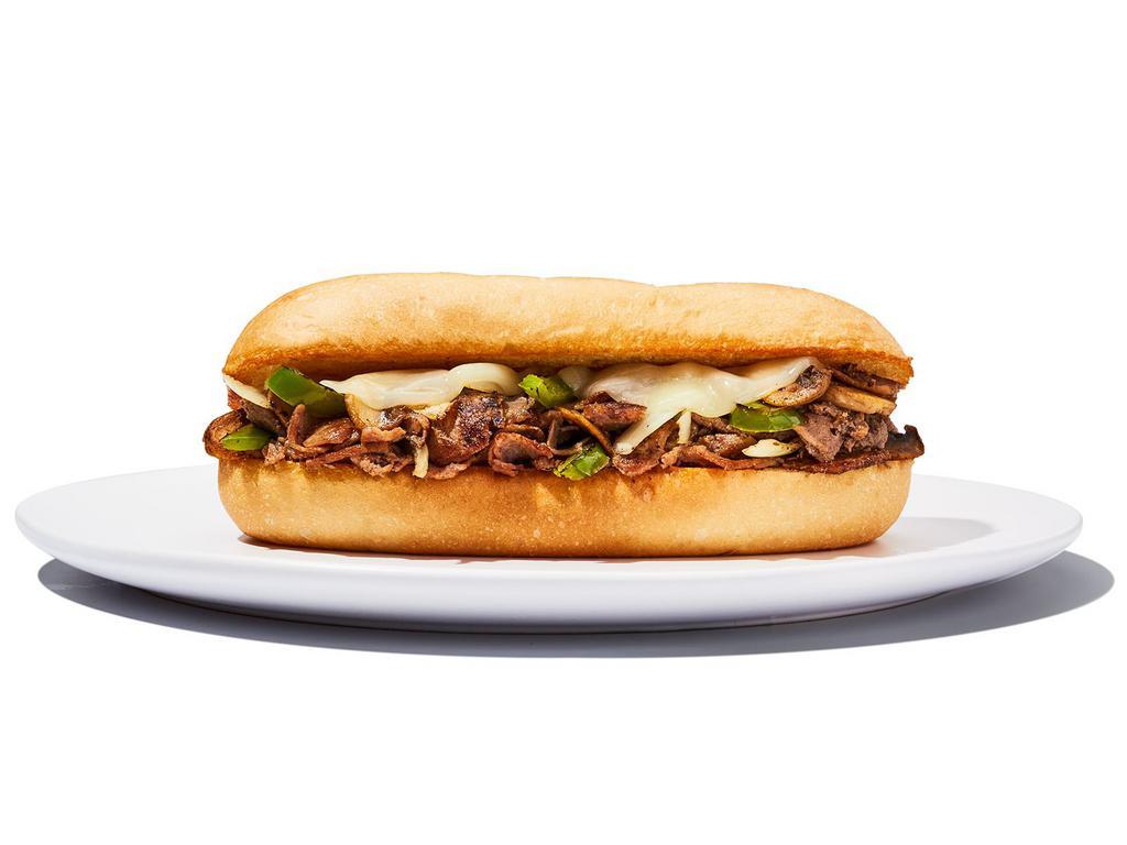 Philly Cheesesteak Sandwich · Yo, Adrian ... I made you a sandwich! Steak or chicken topped with sautéed onions, green peppers, mushrooms and provolone cheese and served on a hoagie roll. Served with side. 