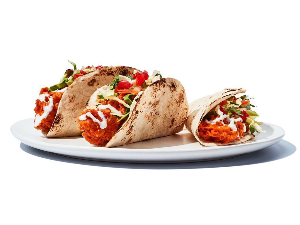 Original Buffalo Chicken Tacos · We’ll buffalo chicken pretty much anything. Grilled or crispy chicken tossed in your favorite wing sauce, topped with cabbage, pico de gallo and your choice of ranch or bleu cheese dressing.