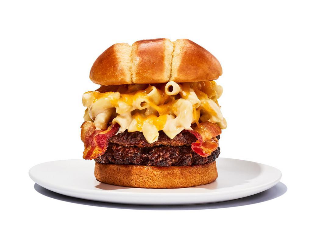 Bacon Mac ’n Cheese Burger · Experience burger bliss with crispy bacon and creamy macaroni and cheese on our ½ pound burger topped with shredded cheddar cheese. 1350 cal
