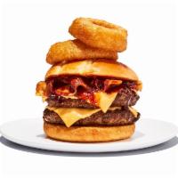 Western BBQ Burger · 2 1/4 lb. patties. It’s like a burger with spurs. BBQ sauce, melted cheddar, bacon, and onio...
