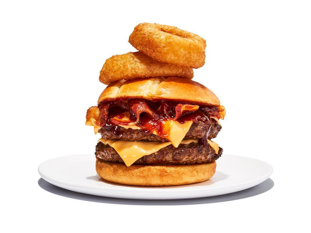 Western BBQ Burger · 2 1/4 lb. patties. It’s like a burger with spurs. BBQ sauce, melted cheddar, bacon, and onion rings all wrangled into a toasted brioche bun.