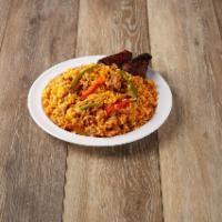 Arroz con Pollo · Yellow rice mix with shredded chicken and sweet plantain.