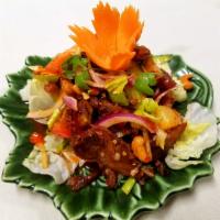 24. Duck Salad · Crispy roasted duck with ginger, pineapple, scallion, onion, celery, tomatoes, cashew nut, c...