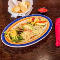 Baja Pollo · Marinated mesquite-grilled breast of chicken smothered with baja queso and topped with fresh...