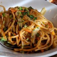 92. Hakka Noddles · Bombay style flat lo mein noodles. Vegan.