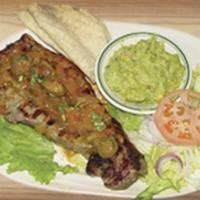 31. Steak Tampiquena · Sirloin steak Mexican style.
