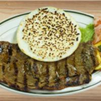 39. Carne Asada y Arepa con Queso  · Grilled top round steak and corn cake topped with cheese.