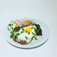 Grilled Pork Chop Rice · Com thit nuong. Grilled pork over broken rice, pickled veggies, and a fried egg.