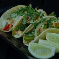 Grilled Chicken Taco · Served with cilantro, onions, radish and lime. 