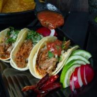 Beef Barbacoa Taco · Homemade shredded beef, onions and chipotle sauce. Served with cilantro, onions, radish and ...