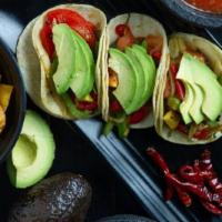 Veggie Avocado Taco · Roasted green and red peppers, tomatoes and avocado. Vegetarian.
