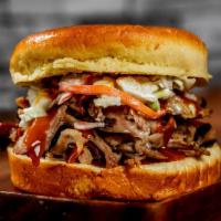 CAROLINA · Pulled Pork, Holy Gold Sauce, and Signature Slaw. Includes Fries and a Drink. 