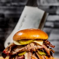 The Boss Hog · Pulles Pork, Brisket, Bacon, Pickle, Swiss cheese, and Holy Gold Sauce. Includes Fries and a...
