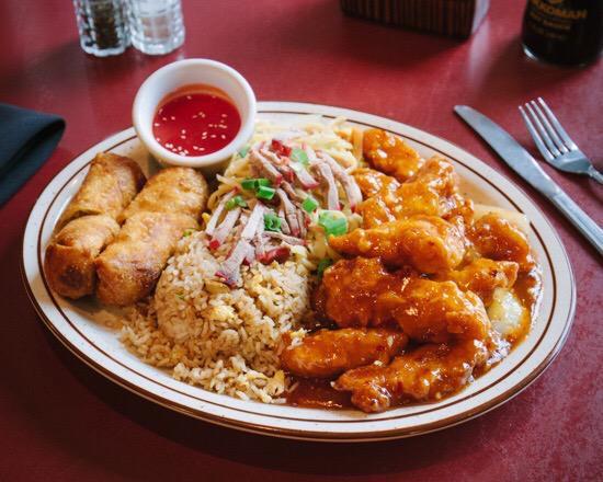 #15. *General Tso's Chicken Combination 十五 · Served spicy, general tsos chicken (with yellow onions & green pepper), 2 egg roll, pork rice, pork chow mein. No substitutions. 