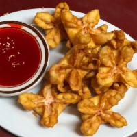 Crab Puffs 10 pcs 蟹饺 · Fried wontons with cream cheese and imitation crab. Sweet and sour sauce on side.