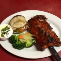 Baby Back Ribs 排骨 · Fall-off-the-bone ribs, mesquite grilled with house sauce. Served with steamed vegetables an...