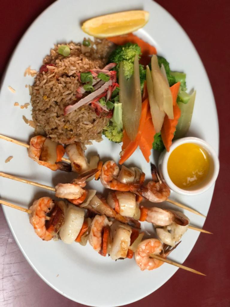 #6-Prawns and Scallops  六, 带子虾串 · 3 skewers of prawns and scallops. Served with steamed vegetable and choice of pork chow mein, pork, fried rice, steamed rice, baked potato or french fries.