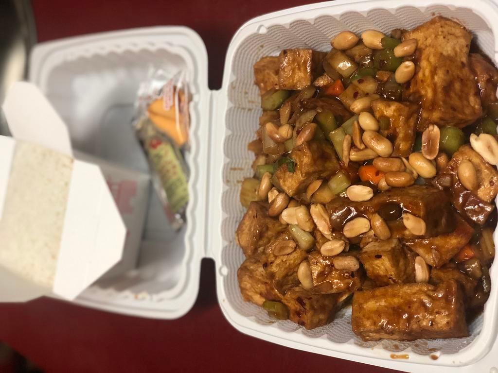 *Kung Pao Tofu 宮保豆付 · Fried tofu, celery, green peppers, water chestnuts, carrots stir fried in house savory sauce, with peanuts atop. Served with steamed rice, pork fried rice or pork chow mein. *Spicy.