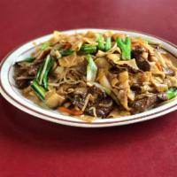 Beef Chow Fun 干炒牛河 · Fresh wide rice noodles, beef stir fried with bean sprouts, scallions, and onions. 
