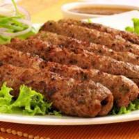 गोष्ठ सीक कबाब Gosth Seekh Kabab ( Lamb ) Halal / Gluten Free · Grilled minced lamb with herbs and spices and cooked on skewers.  Served with salad, makhani...