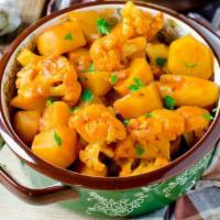 मसालदार गोभी आलू Masaladar Gobhi Aloo Gluten Free / Vegan · Potatoes and cauliflower cooked in mild spices with tomato and ginger. Served with basmati r...