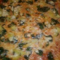 Mediterranean pie  · Fresh spinach ,artichoke ,feta cheese ,roasted garlic and olive oil.