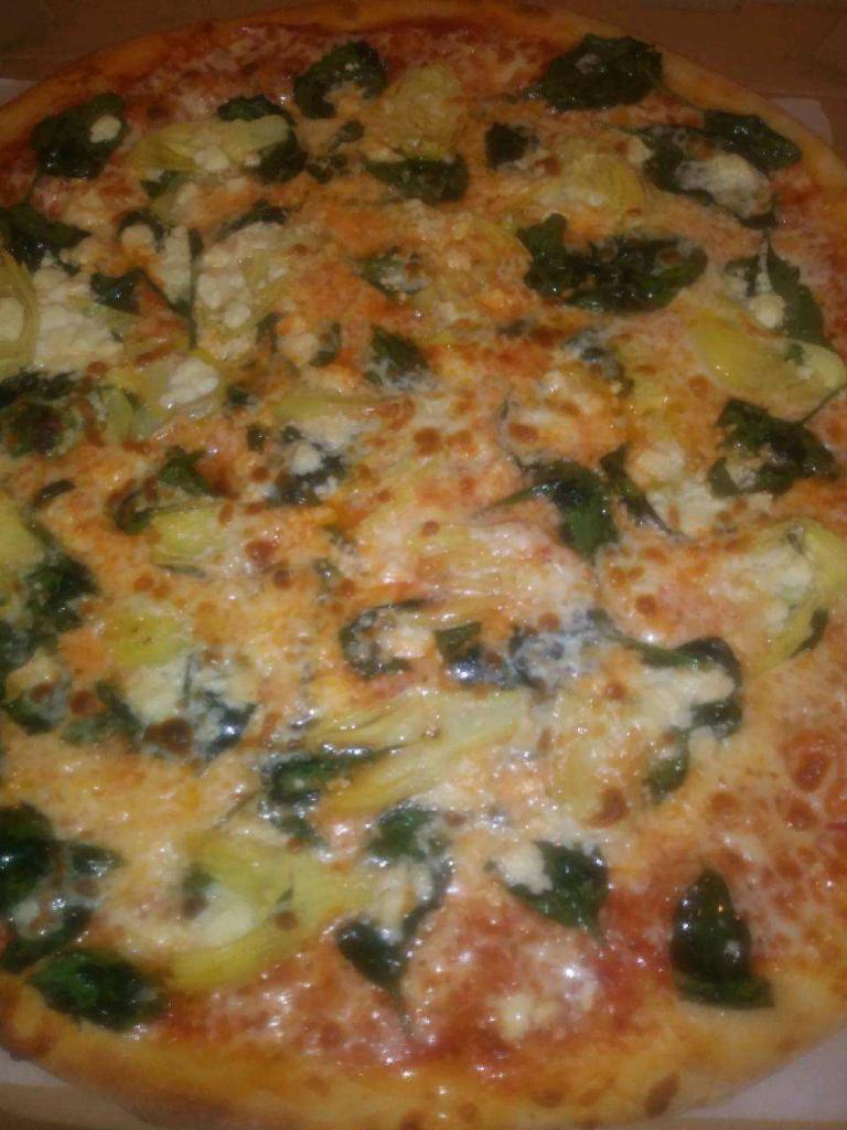 Mediterranean pie  · Fresh spinach ,artichoke ,feta cheese ,roasted garlic and olive oil.
