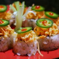 Panic Roll · Spicy tuna toll topped with spicy crabmeat and jalapeno with spicy sauce on top.