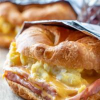 Ham and Egg Croissant · Grilled Ham, scrambled eggs and melted swiss cheese. Served on a grilled croissant.