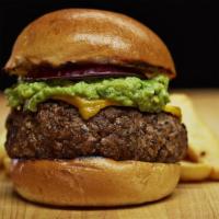 Guacamole Burger · Served with melted cheddar cheese, warm corn tortilla chips, guacamole and sour cream on the...