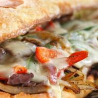 California Cheese Steak · Thinly sliced grilled steak, sautéed mushroom, onions, peppers, swiss and cheddar cheese. Se...