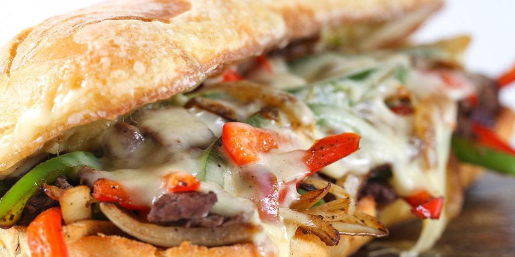 California Cheese Steak · Thinly sliced grilled steak, sautéed mushroom, onions, peppers, swiss and cheddar cheese. Served on a toasted semolina roll.