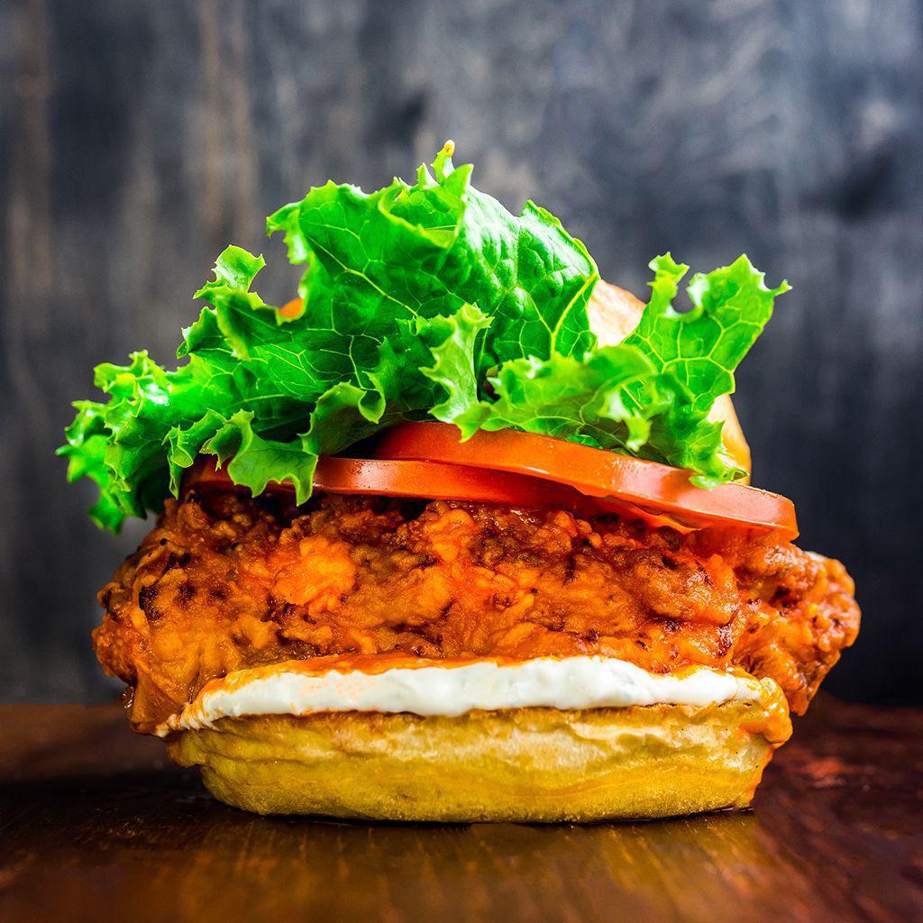 Spicy Crispy Chicken Sandwich · Crispy chicken tenders, swiss cheese, buffalo sauce, lettuce and tomato. Served on a toasted brioche bun. Served with  8oz. Cup potato salad or coleslaw. Substitute steak fries for an extra charge.