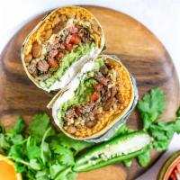Burrito · Meat,Pinto Beans, Shredded Jack Cheese,Sour Cream, Rice and Homemade Salsa Wrapped in a Larg...