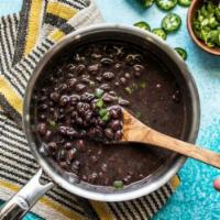 Homemade Vegetarian Black Beans · Topped with cheddar or Jack cheese is for an additional charge.