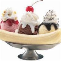 Banana Split · Three Scoops Of Ice Cream, Sliced Bananas, Shaved Almonds, Cherry, Hot Fudge Topped With Van...