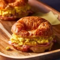 Kids Croissant Breakfast Sandwich (No.10) ·  Croissant, Scramble Eggs, Swiss Cheese & Ham. Served with French Fries.