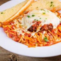 Chicken Parmigiana · Breaded chicken breast baked with marinara sauce, topped with baked mozzarella cheese, shave...