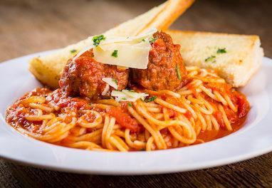 Spaghetti and Meatballs · Traditional spaghetti with marinara sauce served with homemade meatballs from the family recipe, topped with shaved Asiago cheese and fresh parsley.