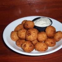 20 Pieces Hushpuppies · Served with a side of tartar sauce.