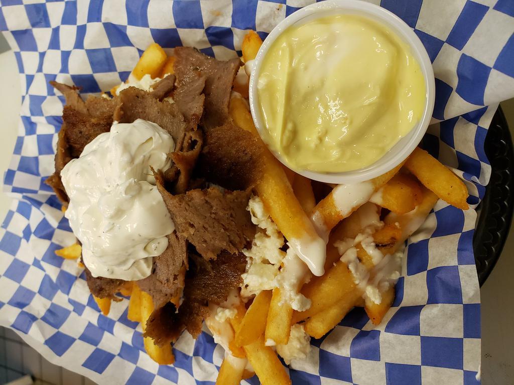 Gyro Fries · Our seasoned fries topped with whipped feta and Chicago gyro meat served with Greek island sauce and tzatziki.